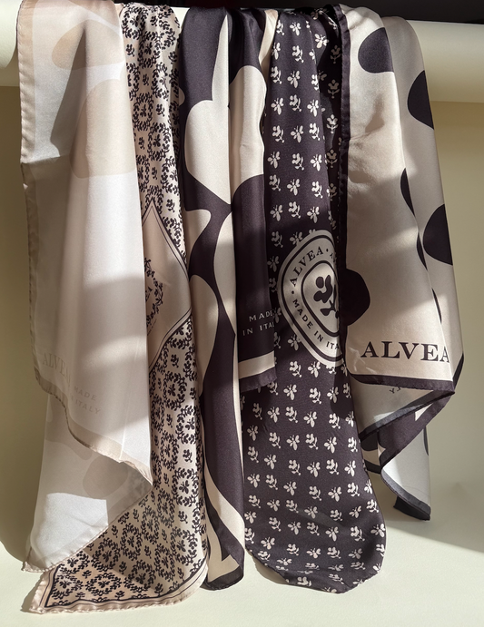 ALVEA patterned silk scarves hanging together in natural light